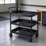 Matte black three-tier steel utility cart in a garage