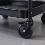 Black swivel caster with brake under the bottom tray