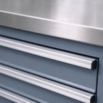 Brushed stainless top edge and aluminum drawer pull