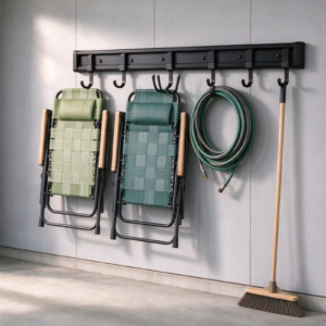 Wall rail with folding chairs, hose and broom