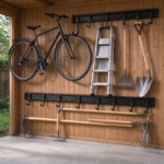 Two storage rails with garden tools in a backyard shed