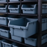 Slate blue open-front bin on a black steel shelf