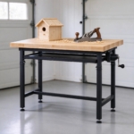 Maple workbench raised to standing height with a woodworking project