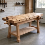 Solid beech carpenter's workbench with vises in a garage workshop