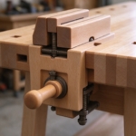 Wooden vise handle and square bench-dog holes in close-up